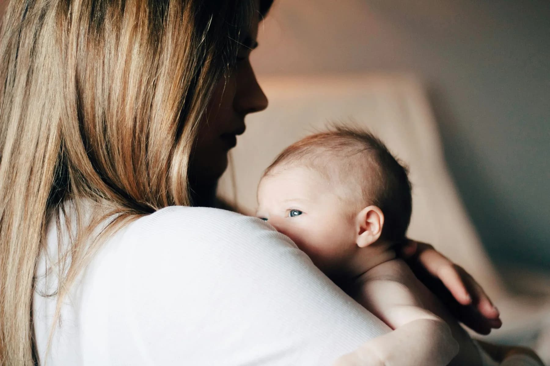 Mother holding her newborn, postpartum anxiety support in Charlotte, NC